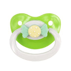 Green and white pacifier with a decorative bow on a white background