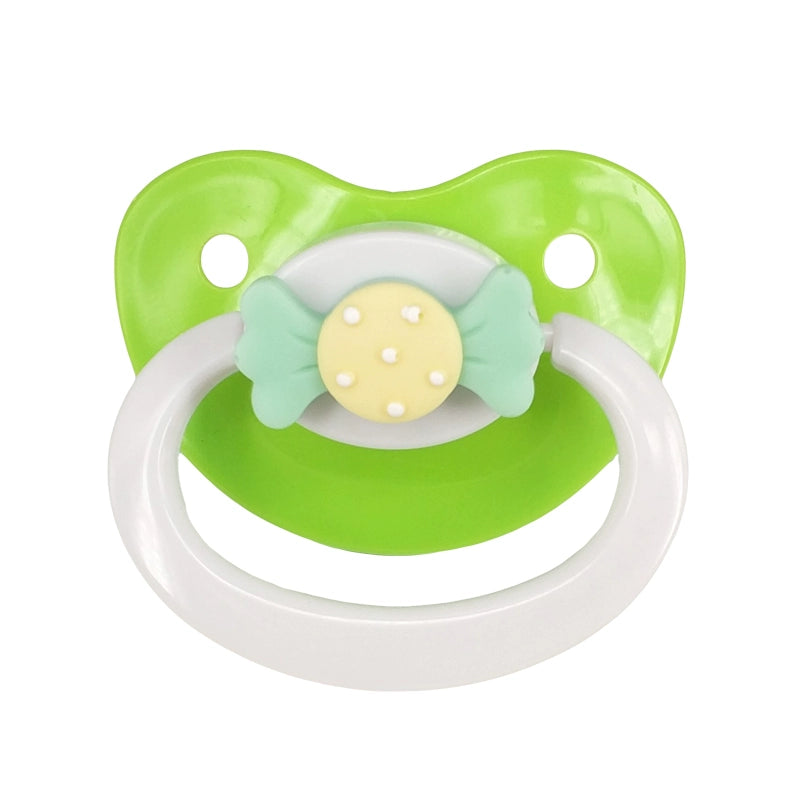 Green and white pacifier with a decorative bow on a white background